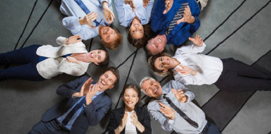 Business team lying on floor and clapping